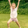 Koszulka dla dziecka biała "Bron to: eat play trouble"