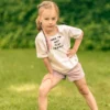 Koszulka dla dziecka biała "Bron to: eat play trouble"